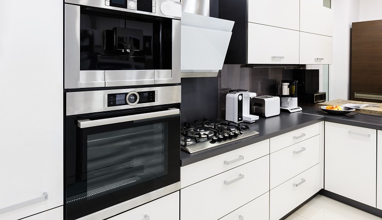 various kitchen appliances in a white big kitchen